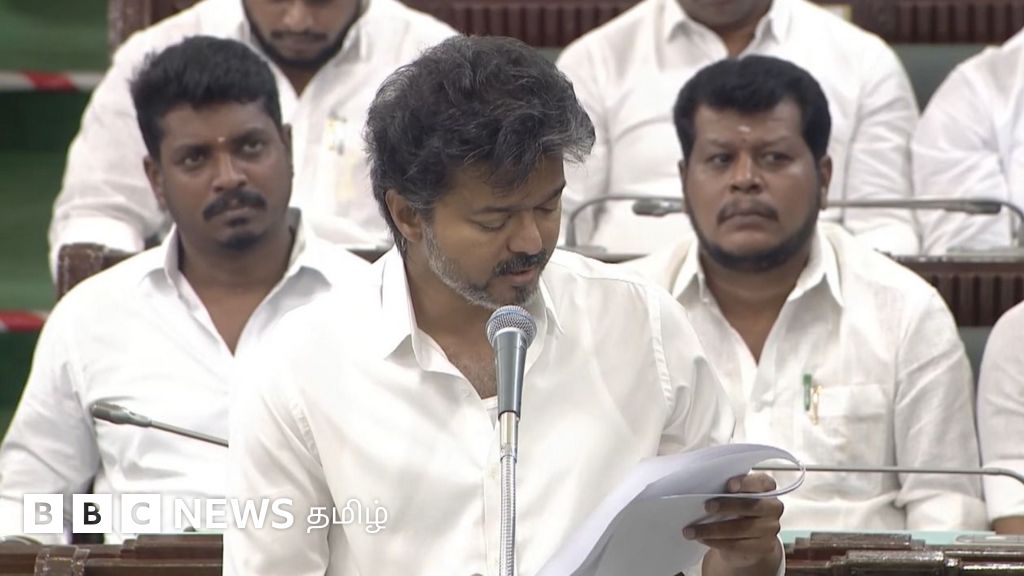 Why are criticisms being raised over Vijay’s government’s resolution regarding the Tamil Thai Vazhthu?